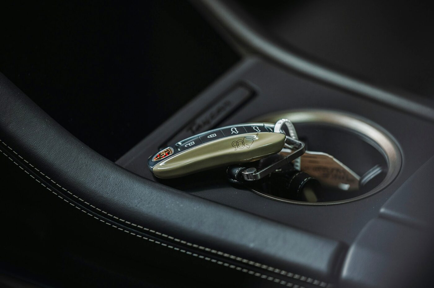 Smart key resting in a dark vehicle console